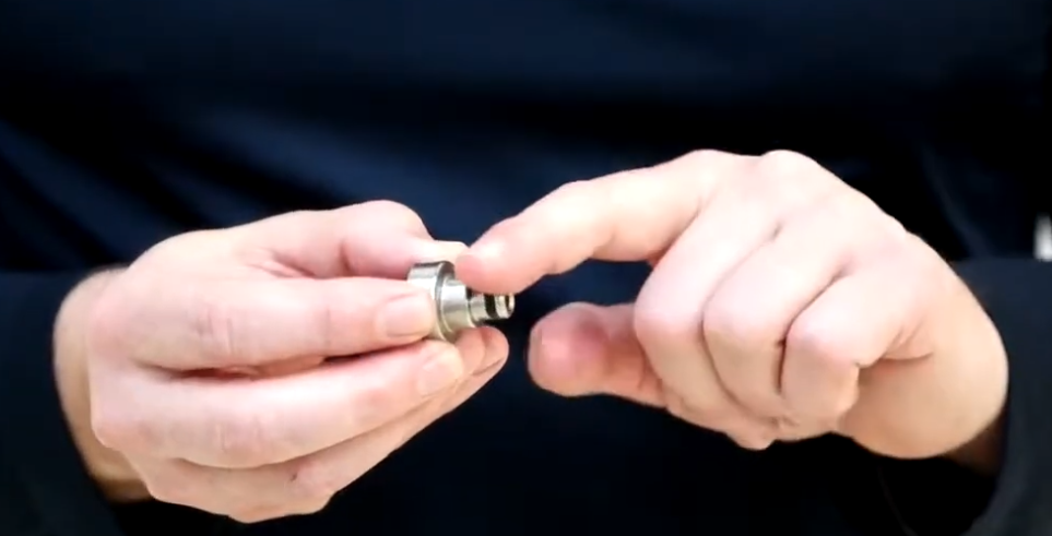 technician showing kitchen equipment part